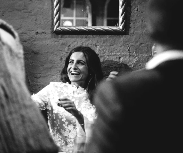 A woman at a party in a LoMonaco dress.