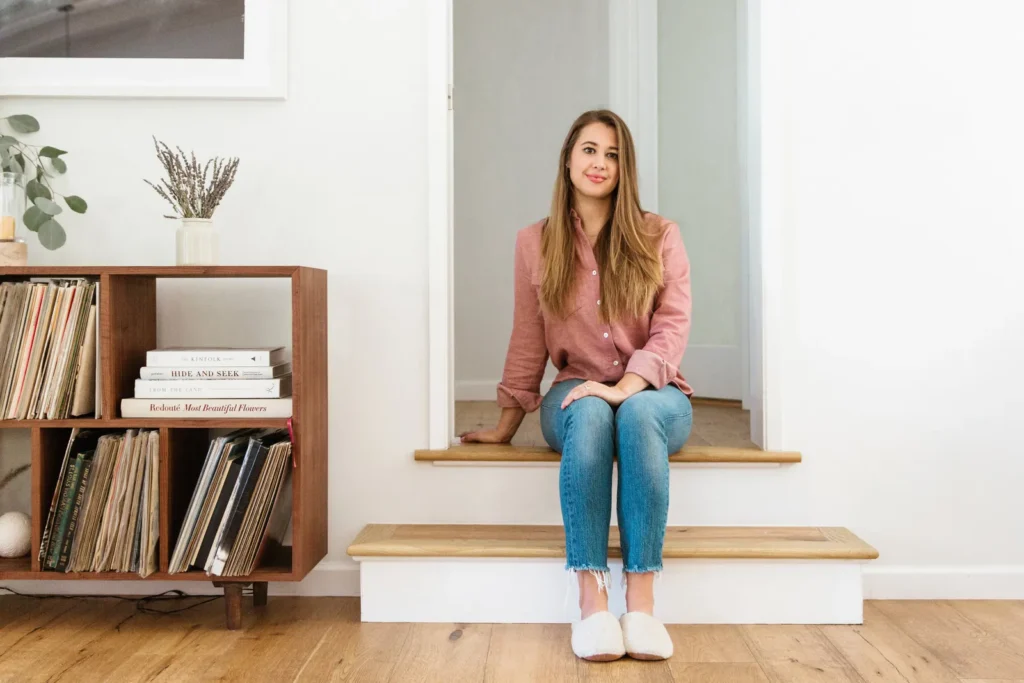 Jenni Kayne sitting on steps