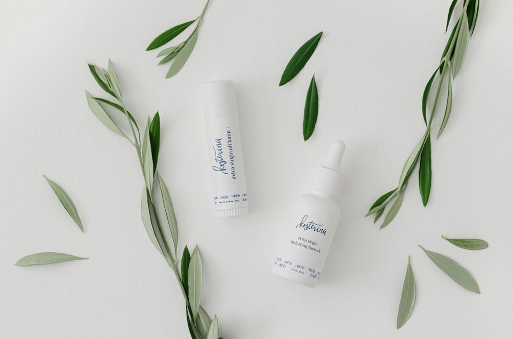 Kosterina balm and face oil with olive branch leaves.